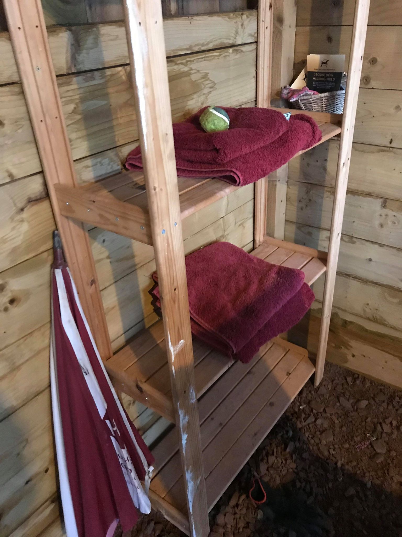 Some towels on a shelf in the shelter